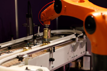 Fototapeta na wymiar conveyor system with pick and place robotic arm