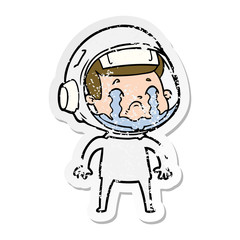 distressed sticker of a cartoon crying astronaut