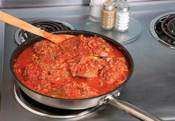 Cooking Chicken Paella in Skillet