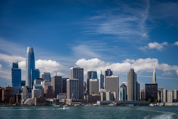 Bright blue skies with wispy clouds over the San Francisco skyline showing the two most famous...