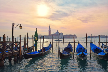 gondolas moored on the Grand Canal, evening in Venice