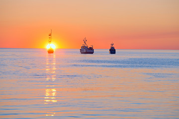 At sunset, ships in the White sea pay tribute to the dead sailors.