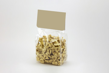 Farfalle pasta in a transparent plastic packaging