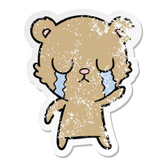 distressed sticker of a crying cartoon bear