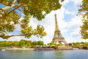 Fototapeta na wymiar Seine river on Eifel tower through sunny sky