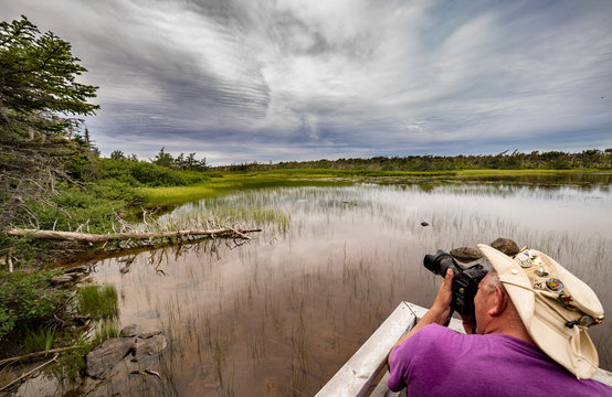 man photographing landscape