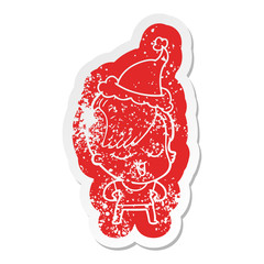 happy cartoon distressed sticker of a girl wearing santa hat