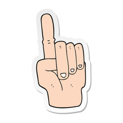 sticker of a cartoon pointing hand