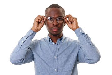 handsome young african american man with glasses by white background