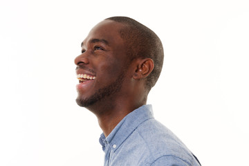 side portrait of laughing african american man looking up