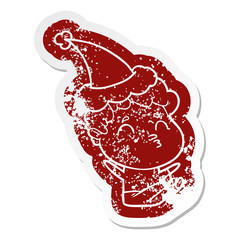 cartoon distressed sticker of a man pouting wearing santa hat