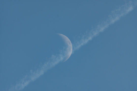 the Moon in blue sky