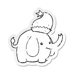 distressed sticker of a cute cartoon christmas elephant