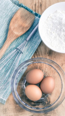 Eggs flour bowls whisk baking ingredients