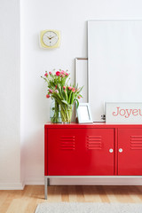 red metal locker picture frames and flowers