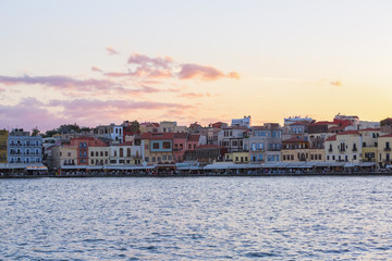 Naklejka premium The city of Chania is a port on the west coast of the Cretan Sea in Greece. A tourist attraction, a long quay, interesting architecture. The Mediterranean Sea. A wonderful summer day for relaxation.