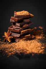 dark chocolate stack and cocoa powder