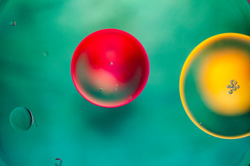 yellow and red bubbles on green background