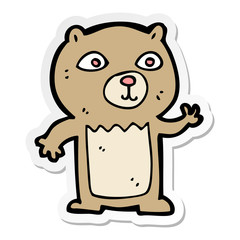 sticker of a cartoon waving teddy bear