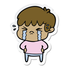 sticker of a cartoon boy crying