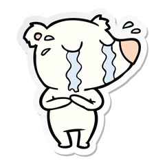 sticker of a cartoon crying polar bear