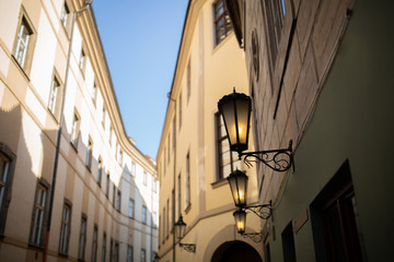 Fototapeta na wymiar Empty street with lanterns in Prague