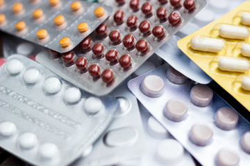 Medicines on wooden table 