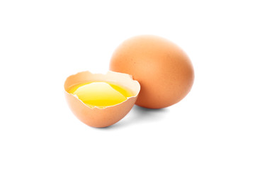 Chicken egg and half yolk isolated on white background