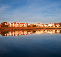 Hendaia is reflected in the water of the beach at sunset, France