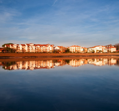 Hendaia is reflected in the water of the beach at sunset, France
