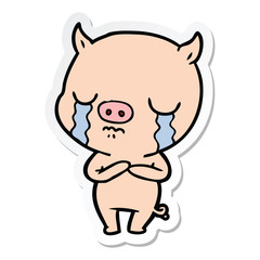 sticker of a cartoon pig crying