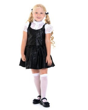 Beautiful little girl in a school uniform.