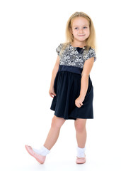 Little girl posing in studio on a white background.