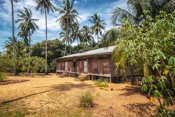 Fototapeta na wymiar BORNEO / SARAWAK / MALAYSIA / JUNE 2014: Isolated house in the middle of the forest
