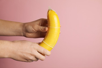 Yellow banana with condom, concept of protected sex.