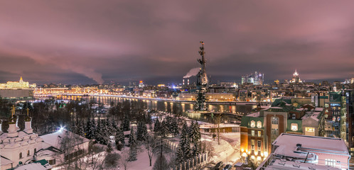Panorama view to the illuminated city center of Moscow at night. Frozen Moscow riwer