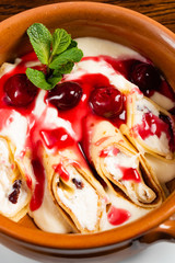 crepes with cottage cheese and berry sauce