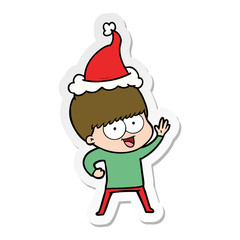 happy sticker cartoon of a boy wearing santa hat