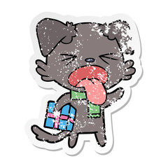 distressed sticker of a cartoon disgusted dog with christmas gift