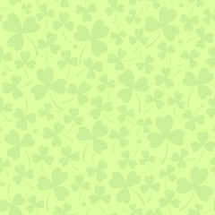 Saint Patrick's day seamless background in light green with cloverleafs and stars. Shamrock irish background. For web, textile, wrapping paper, wallpaper, banner, card. Vector illustration.
