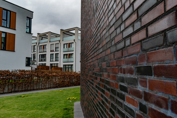 Side wall leading lines towards modern apartment complex