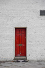 door in red wall