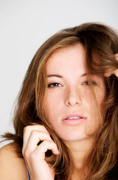 Redhead woman with fleckles on white background. Sensual lady.