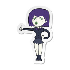 sticker of a cartoon vampire girl giving thumbs up