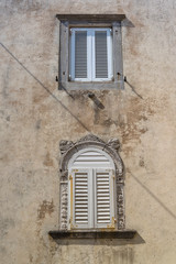 Fototapeta na wymiar Two windows, town of Krk on the island of Krk, Croatia