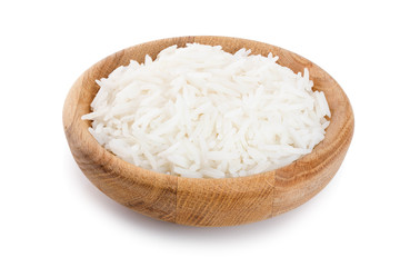 rice in a wooden bowl isolated on white background. Top view. Flat lay
