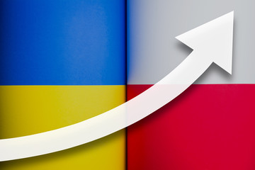 White arrow growth up on the background of flags of Poland and Ukraine