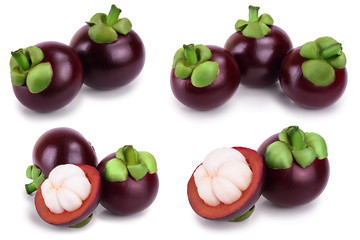 ripe mangosteen with leaves isolated on white background closeup. Set or collection