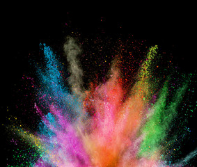 Explosion of colored powder on black background