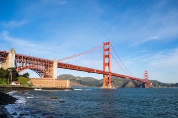 Surf in front of Golden Gate Bridge worldwide known symbol of California